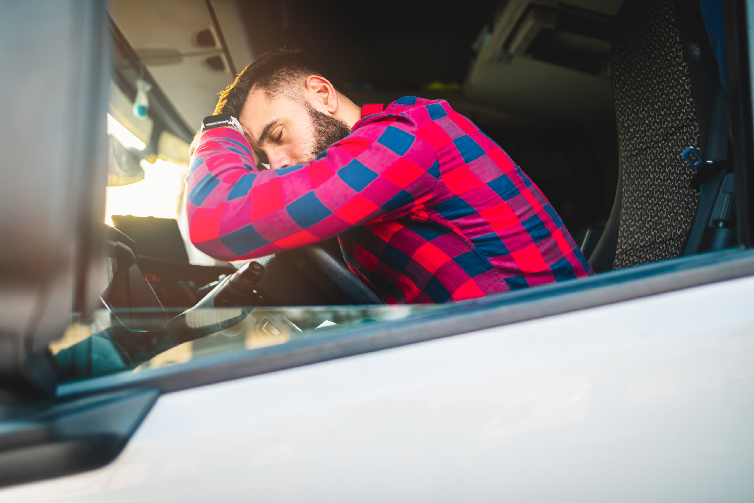 trucker asleep behind the wheel